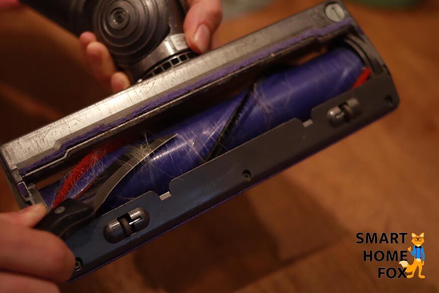 Remove the hair from the brush with a knife.